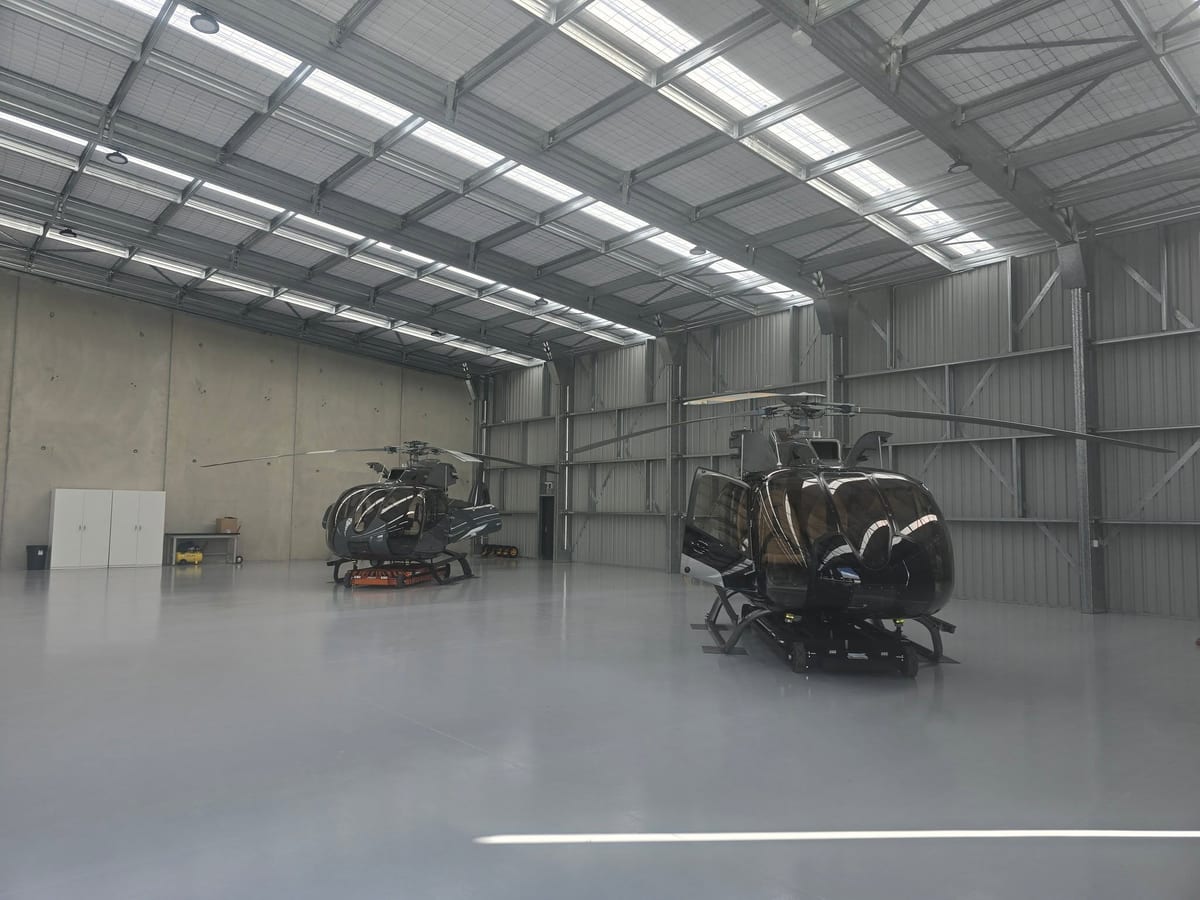 Helicopter hangar designed by Stable Structure — a clear-span steel portal building with column-free floor spa
